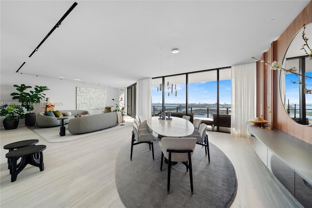 1000 Biscayne Blvd Unit 3201, Miami, FL 33132 - dining area featuring floor to ceiling windows, a water view, and light wood-style flooring