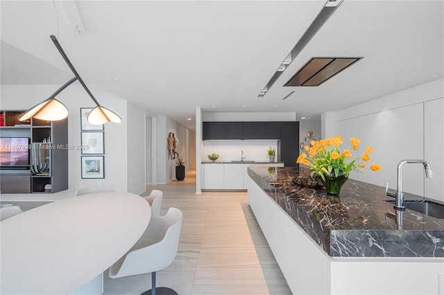 1000 Biscayne Blvd Unit 3201, Miami, FL 33132 - kitchen with a sink, modern cabinets, and dark countertops