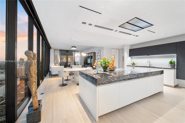 1000 Biscayne Blvd Unit 3201, Miami, FL 33132 - kitchen featuring a sink, modern cabinets, and a large island with sink