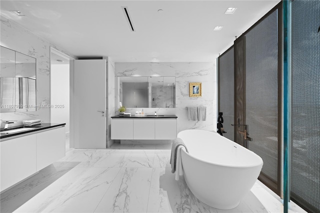 1000 Biscayne Blvd Unit 3201, Miami, FL 33132 - full bath featuring two vanities, a soaking tub, marble finish floors, and tile walls