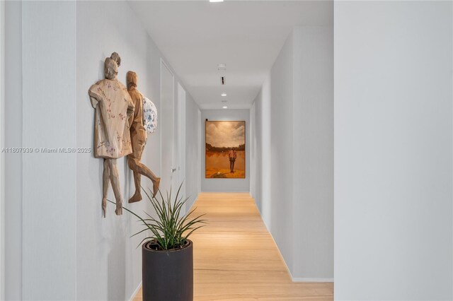 1000 Biscayne Blvd Unit 3201, Miami, FL 33132 - hallway featuring wood finished floors, baseboards, and recessed lighting