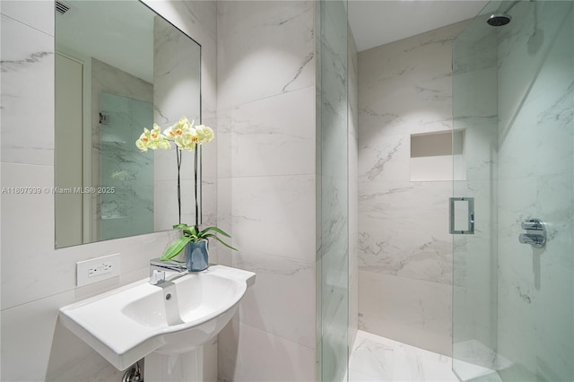 1000 Biscayne Blvd Unit 3201, Miami, FL 33132 - full bathroom with a marble finish shower and tile walls