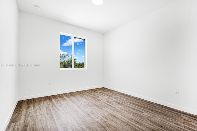22519 SW 125th Ave Unit B, Miami, FL 33170 - unfurnished room with wood finished floors, baseboards, and a smoke detector