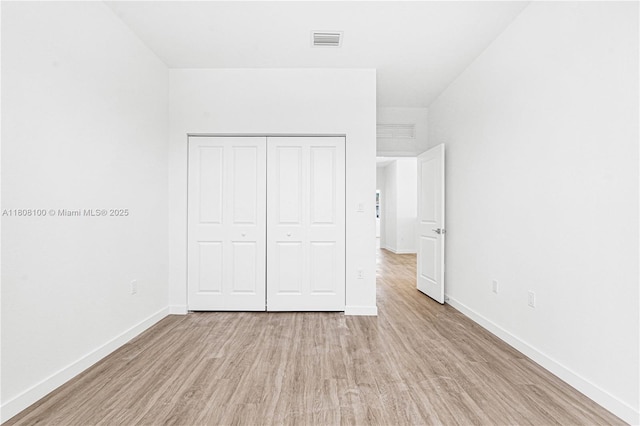 22519 SW 125th Ave Unit B, Miami, FL 33170 - unfurnished bedroom featuring light wood finished floors, baseboards, and a closet
