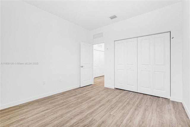 22519 SW 125th Ave Unit B, Miami, FL 33170 - unfurnished bedroom with light wood-type flooring, baseboards, and a closet