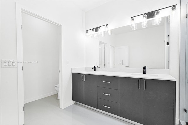 22519 SW 125th Ave Unit B, Miami, FL 33170 - full bathroom with toilet, double vanity, and baseboards