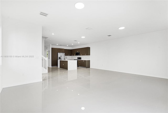 22519 SW 125th Ave Unit B, Miami, FL 33170 - unfurnished living room with recessed lighting and light tile patterned floors