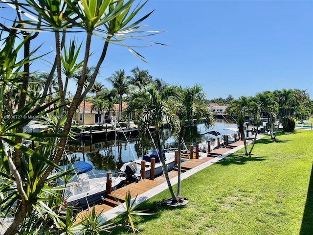 301 E Mcnab Rd Unit 205, Pompano Beach, FL 33060 - dock featuring a yard and a water view