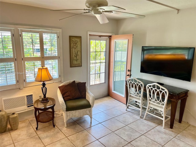 301 E Mcnab Rd Unit 205, Pompano Beach, FL 33060 - sitting room featuring a ceiling fan, healthy amount of natural light, light tile patterned floors, and a wall mounted AC