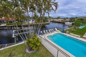 301 E Mcnab Rd Unit 205, Pompano Beach, FL 33060 - community pool featuring a water view