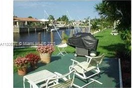 301 E Mcnab Rd Unit 205, Pompano Beach, FL 33060 - view of patio with a water view