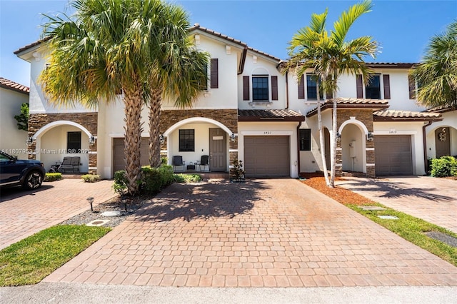 5421 NW 27th St, Margate, FL 33063 - view of front facade featuring stucco siding, stone siding, and decorative driveway