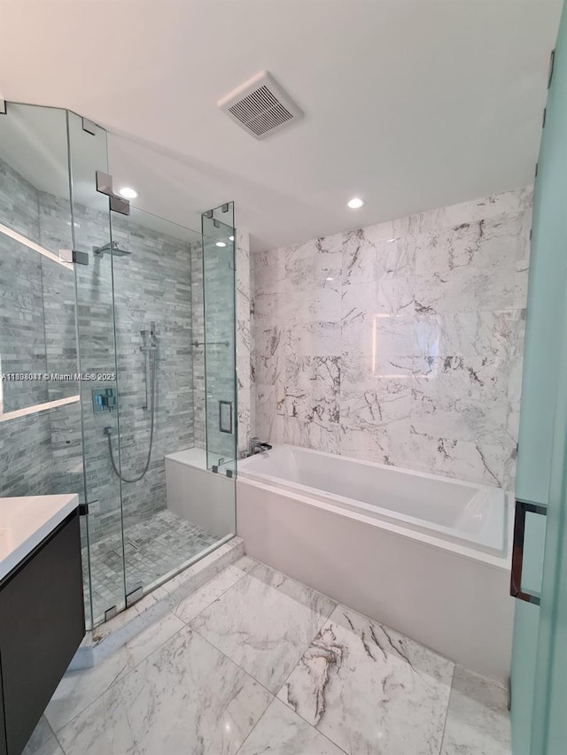 851 NE 1st Ave Unit 3801, Miami, FL 33132 - bathroom with a bath, a stall shower, vanity, recessed lighting, and marble finish flooring