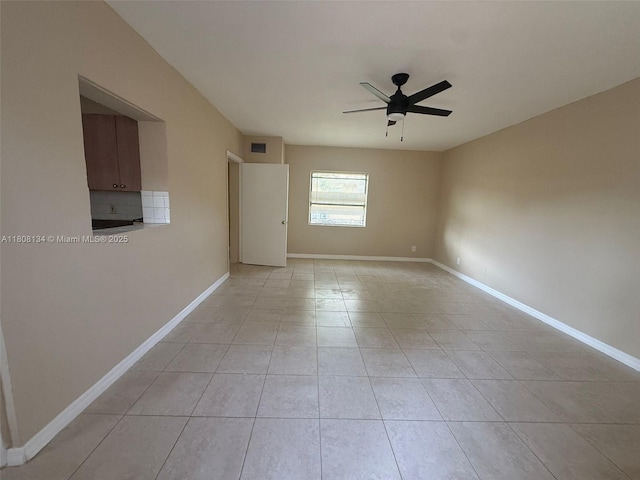 1025 NW 3rd Ave, Fort Lauderdale, FL 33311 - unfurnished room featuring a ceiling fan, light tile patterned flooring, and baseboards