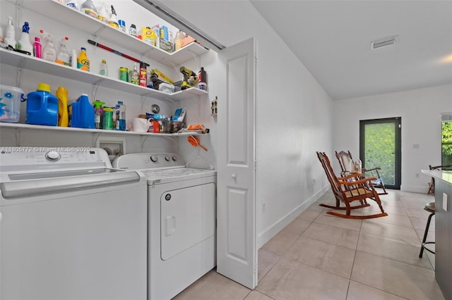 32004 SW 199th Ct, Homestead, FL 33030 - laundry area featuring washing machine and dryer, light tile patterned flooring, and baseboards