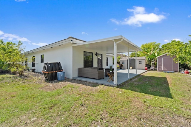 32004 SW 199th Ct, Homestead, FL 33030 - rear view of property with a patio area, stucco siding, a yard, and an outdoor living space
