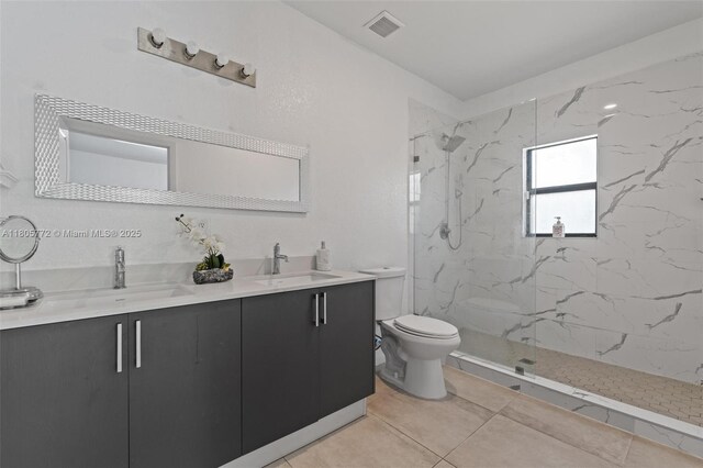 32004 SW 199th Ct, Homestead, FL 33030 - full bath featuring toilet, double vanity, a marble finish shower, and tile patterned floors