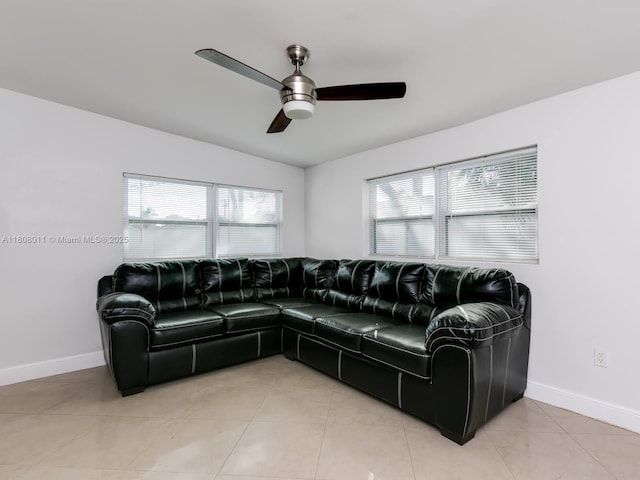870 NE 182nd St, North Miami Beach, FL 33162 - living area featuring a ceiling fan, baseboards, vaulted ceiling, and light tile patterned flooring