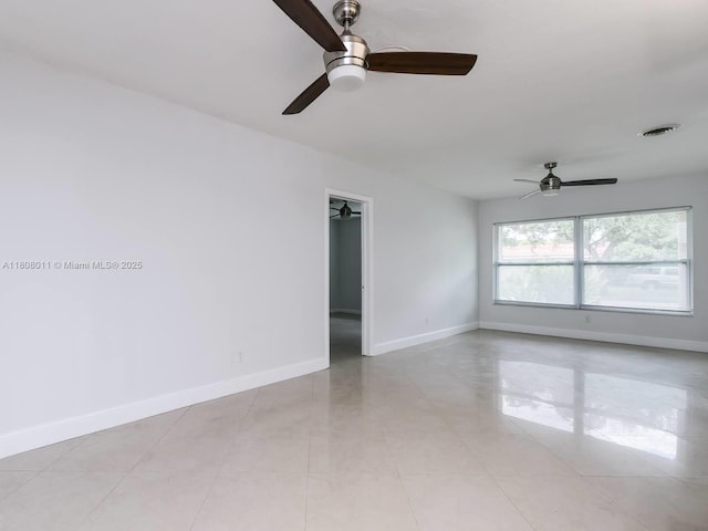 870 NE 182nd St, North Miami Beach, FL 33162 - spare room with ceiling fan and baseboards