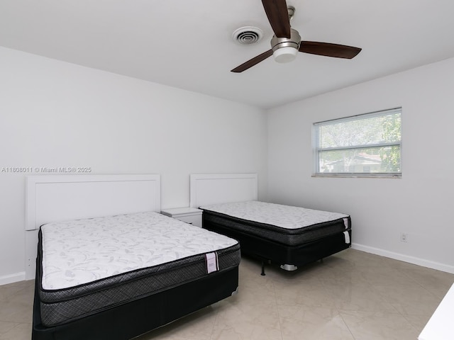870 NE 182nd St, North Miami Beach, FL 33162 - bedroom with ceiling fan and baseboards