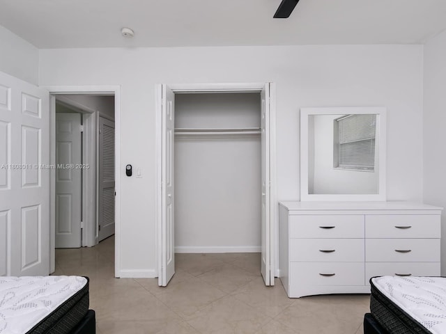 870 NE 182nd St, North Miami Beach, FL 33162 - bedroom with a closet, baseboards, and ceiling fan