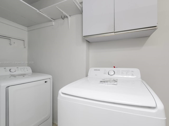 870 NE 182nd St, North Miami Beach, FL 33162 - laundry area with washing machine and dryer and cabinet space