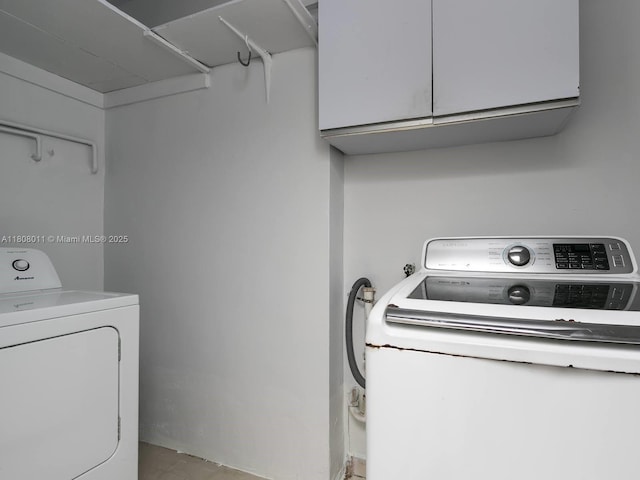 870 NE 182nd St, North Miami Beach, FL 33162 - washroom featuring cabinet space and washing machine and dryer