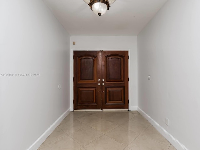 870 NE 182nd St, North Miami Beach, FL 33162 - doorway to outside with baseboards and light tile patterned floors