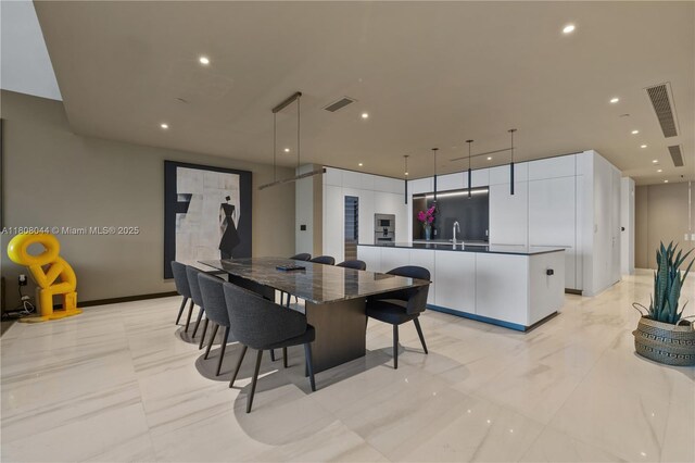 300 Biscayne Blvd Way Unit 3104, Miami, FL 33131 - dining room featuring light marble finish flooring, recessed lighting, and baseboards