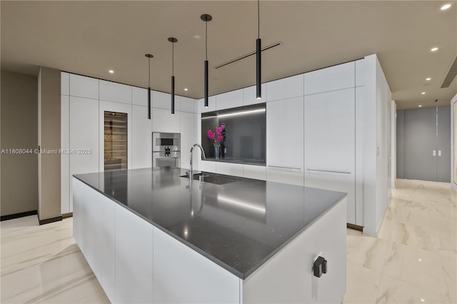 300 Biscayne Blvd Way Unit 3104, Miami, FL 33131 - kitchen with a sink, modern cabinets, light marble finish floors, white cabinets, and a spacious island