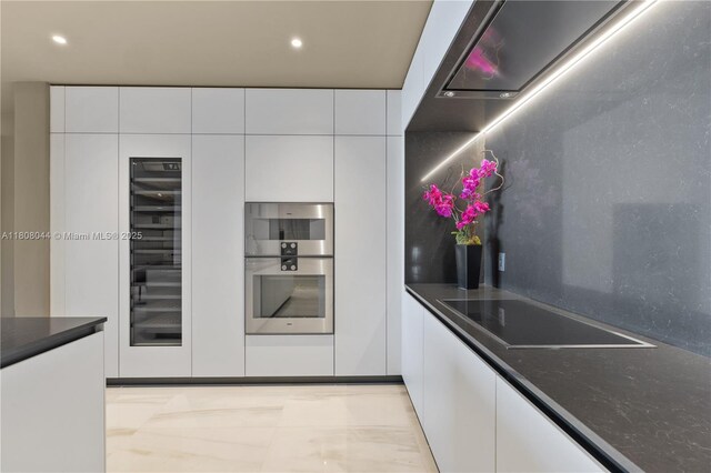 300 Biscayne Blvd Way Unit 3104, Miami, FL 33131 - kitchen with black electric stovetop, white cabinets, modern cabinets, dark countertops, and recessed lighting