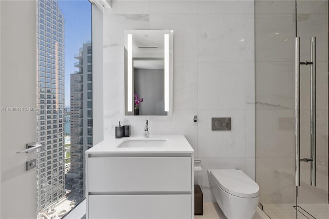300 Biscayne Blvd Way Unit 3104, Miami, FL 33131 - full bath with tile walls, a shower stall, toilet, vanity, and a view of city