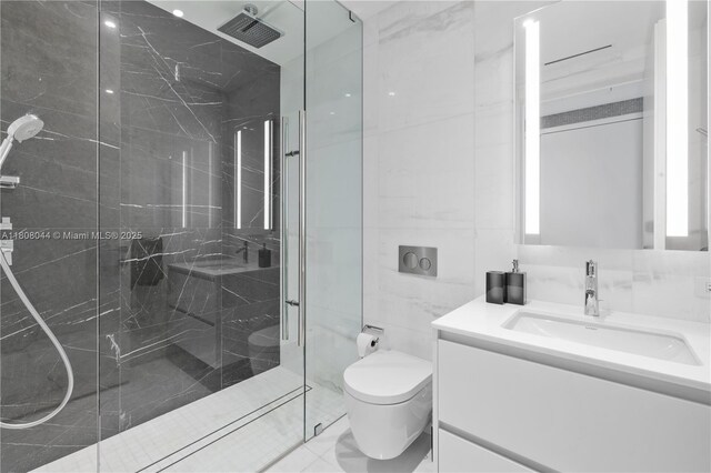 300 Biscayne Blvd Way Unit 3104, Miami, FL 33131 - full bathroom with vanity, a marble finish shower, toilet, and tile walls
