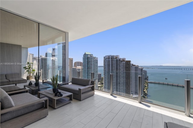 300 Biscayne Blvd Way Unit 3104, Miami, FL 33131 - view of patio with a water view, an outdoor living space, a balcony, and a skyline view
