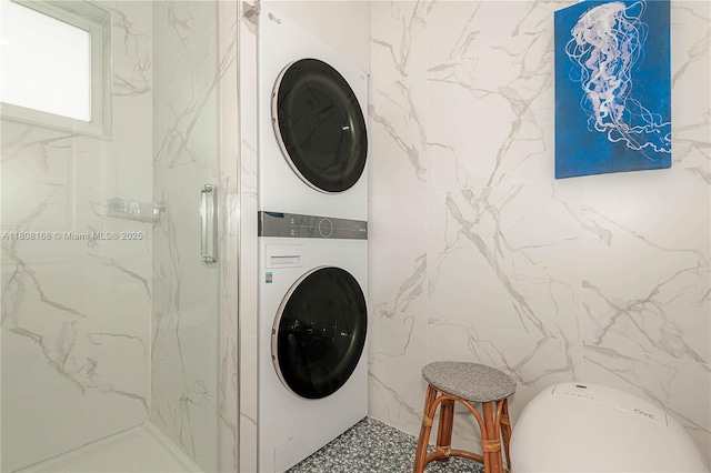1050 SW 11th St Unit 20L, Hallandale Beach, FL 33009 - laundry room with estacked washer and dryer and tile walls