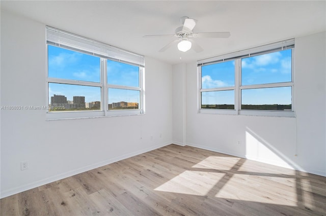 2665 SW 37th Ave Unit 906, Miami, FL 33133 - unfurnished room featuring wood finished floors, ceiling fan, and baseboards