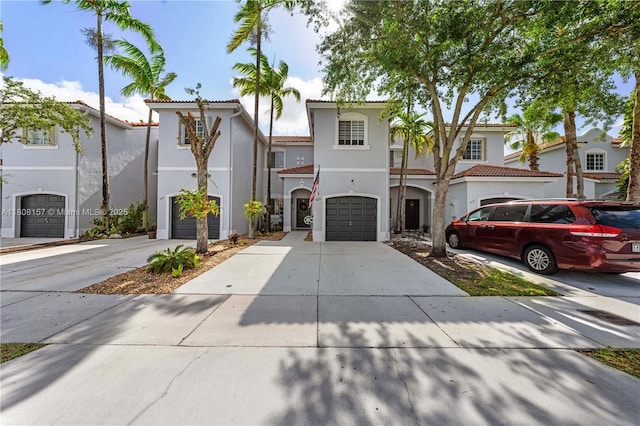 925 SW 147th Ct, Miami, FL 33194 - view of front of property featuring stucco siding, driveway, a tile roof, and a garage