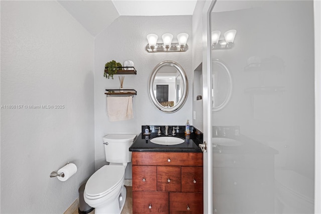 925 SW 147th Ct, Miami, FL 33194 - bathroom with toilet, vanity, and lofted ceiling
