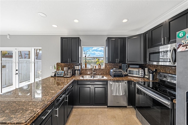 925 SW 147th Ct, Miami, FL 33194 - kitchen with appliances with stainless steel finishes, a sink, a peninsula, backsplash, and crown molding