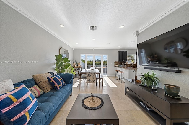 925 SW 147th Ct, Miami, FL 33194 - living area with ornamental molding, a textured wall, recessed lighting, and french doors