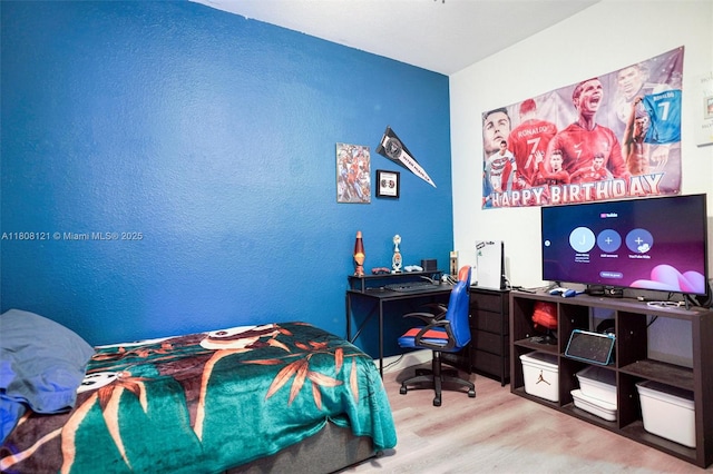 23558 SW 113th Psge, Homestead, FL 33032 - bedroom with wood finished floors and a desk