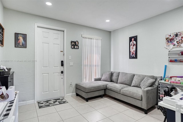 23558 SW 113th Psge, Homestead, FL 33032 - living room with light tile patterned flooring, recessed lighting, baseboards, and a textured wall