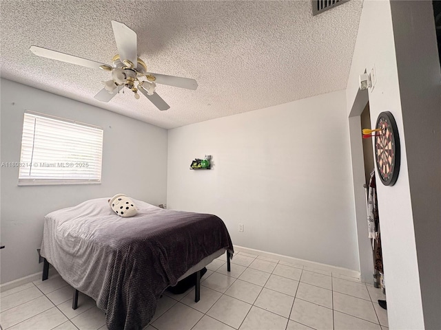 5183 Cannon Way, West Palm Beach, FL 33415 - bedroom featuring light tile patterned flooring, a textured ceiling, ceiling fan, and baseboards