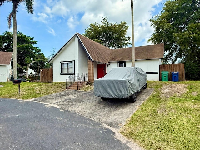 13550 SW 286th St, Homestead, FL 33033 - view of front of house with stucco siding and asphalt driveway
