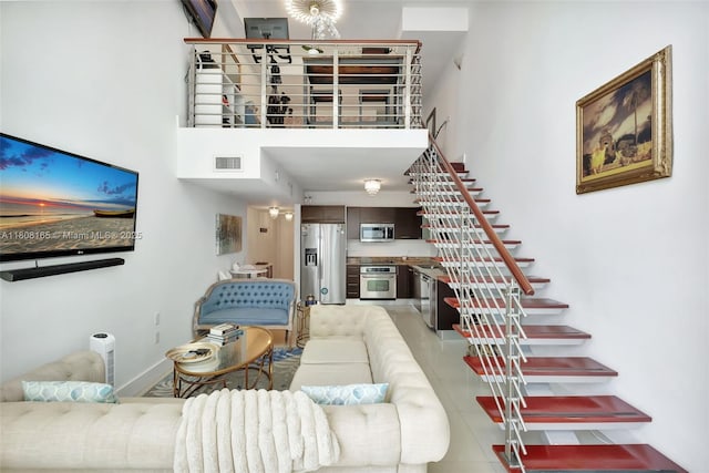 41 SE 5th St Unit 1012, Miami, FL 33131 - living area with a high ceiling and baseboards