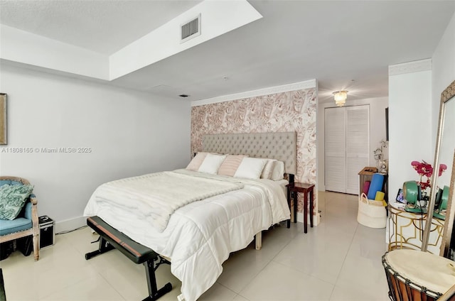 41 SE 5th St Unit 1012, Miami, FL 33131 - bedroom featuring an accent wall, wallpapered walls, and light tile patterned flooring