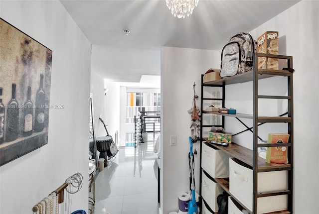 41 SE 5th St Unit 1012, Miami, FL 33131 - hall featuring tile patterned floors and a chandelier