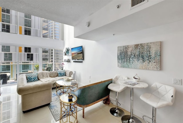 41 SE 5th St Unit 1012, Miami, FL 33131 - living room with tile patterned flooring and baseboards