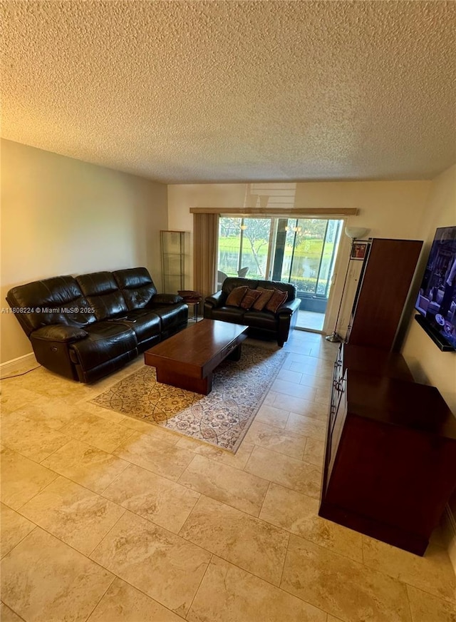 14360 Strathmore Ln Unit 102, Delray Beach, FL 33446 - living room featuring a textured ceiling