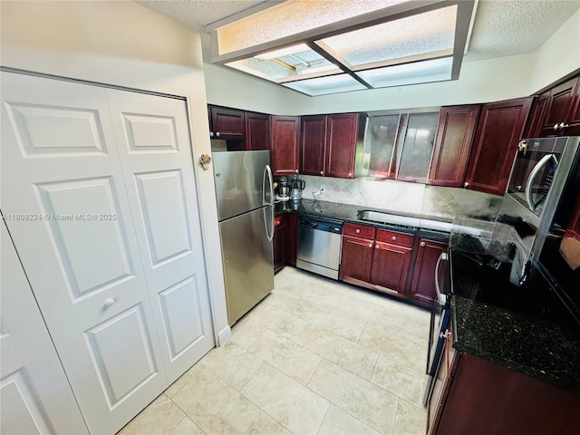 14360 Strathmore Ln Unit 102, Delray Beach, FL 33446 - kitchen featuring stainless steel appliances, dark brown cabinets, backsplash, a textured ceiling, and light tile patterned flooring